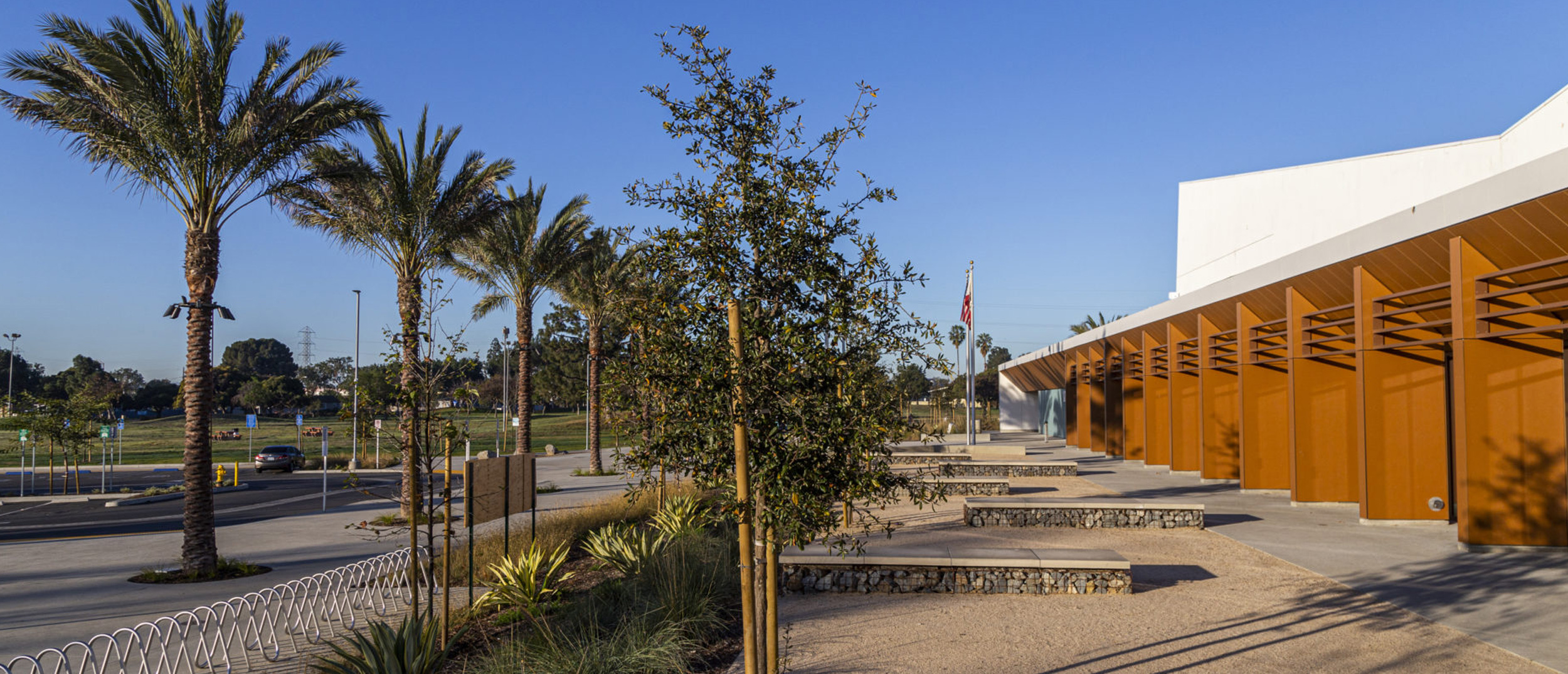 A view of the modern community building and palm trees at the Earvin “Magic” Johnson Recreation Area, one of the region's Multi-benefit water projects featuring advanced stormwater recycling.