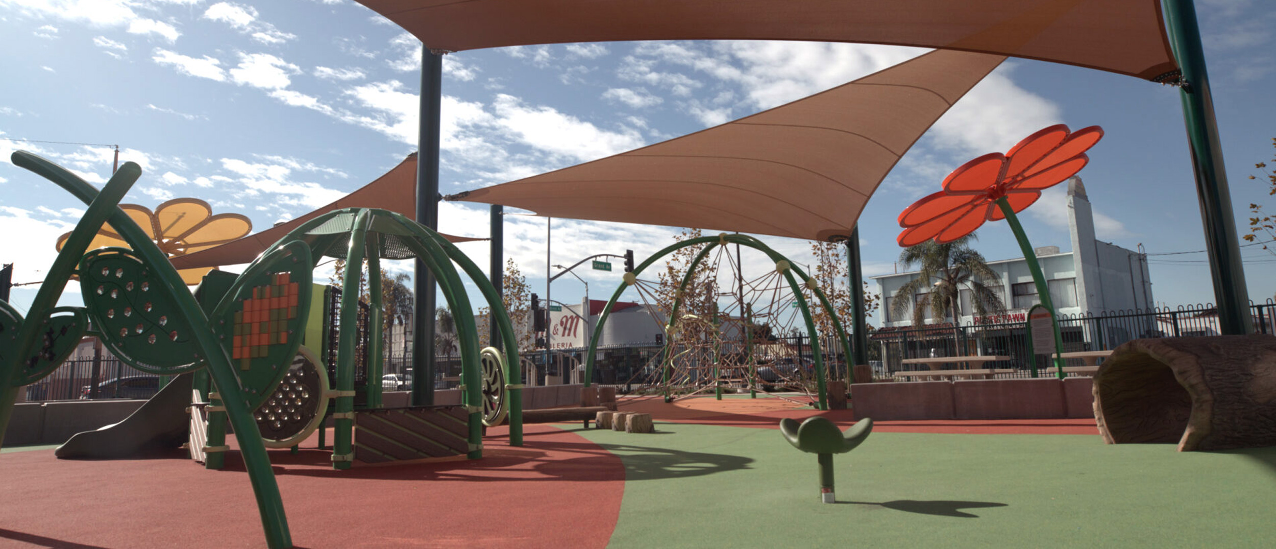 A view of the modern playground at Nogales Park, one of the region's Multi-benefit water projects, featuring flower-shaped shade structures and integrated stormwater management systems.