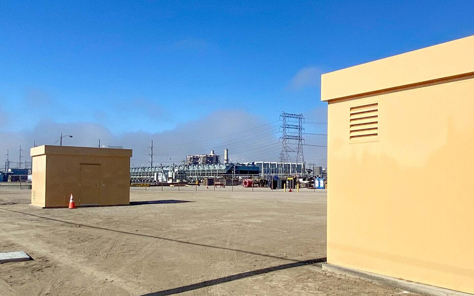 A view of the concrete infrastructure and utility buildings at the Alamitos Barrier Project, a critical component of Sustainable water infrastructure in Long Beach.