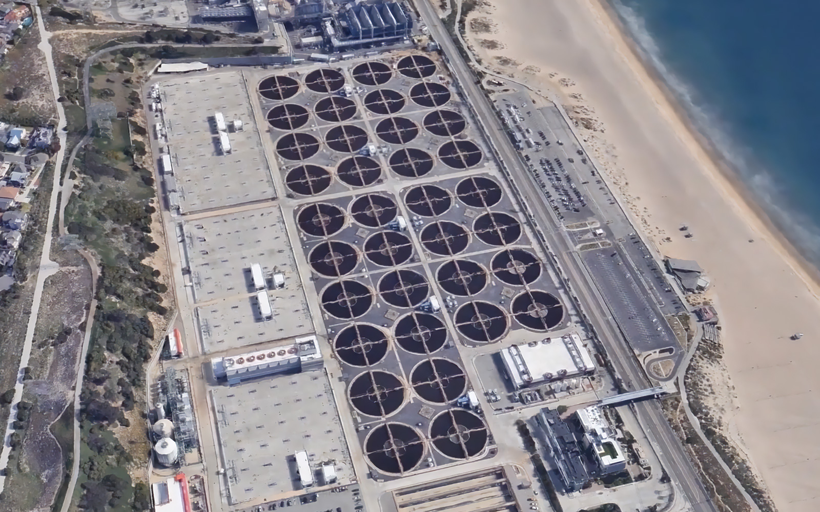 An aerial photo of the Pure Water Southern California plant showing the treatment basins located along the coastline