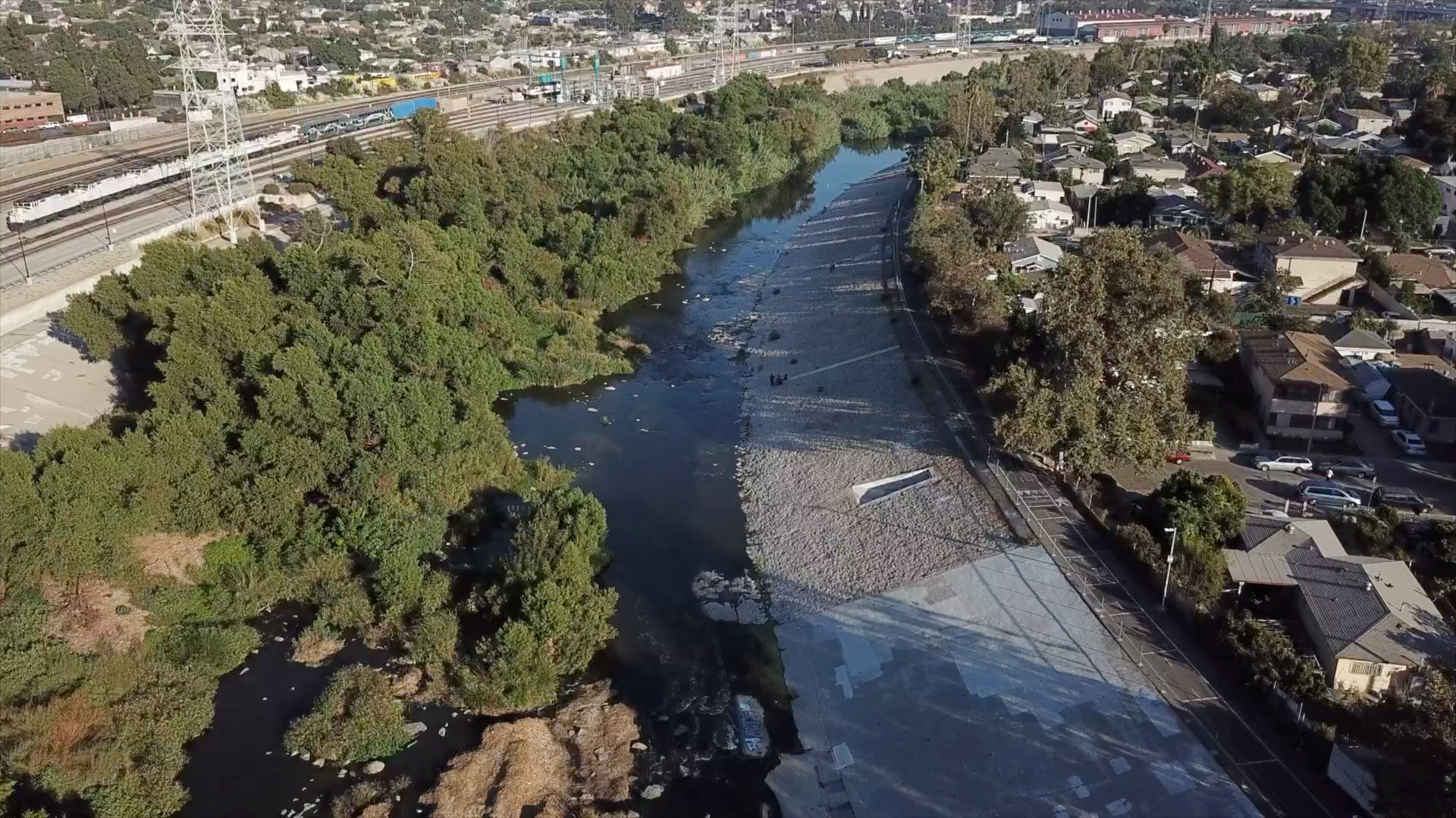 Aerial view of a regional waterway running through a residential neighborhood