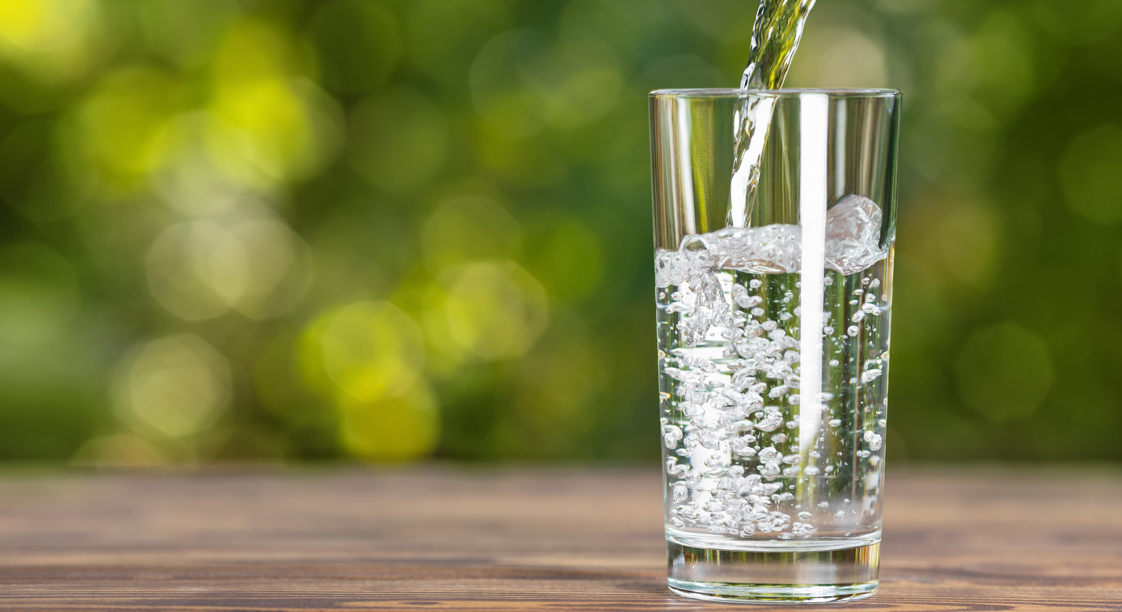 photo of a water being poured into a glass